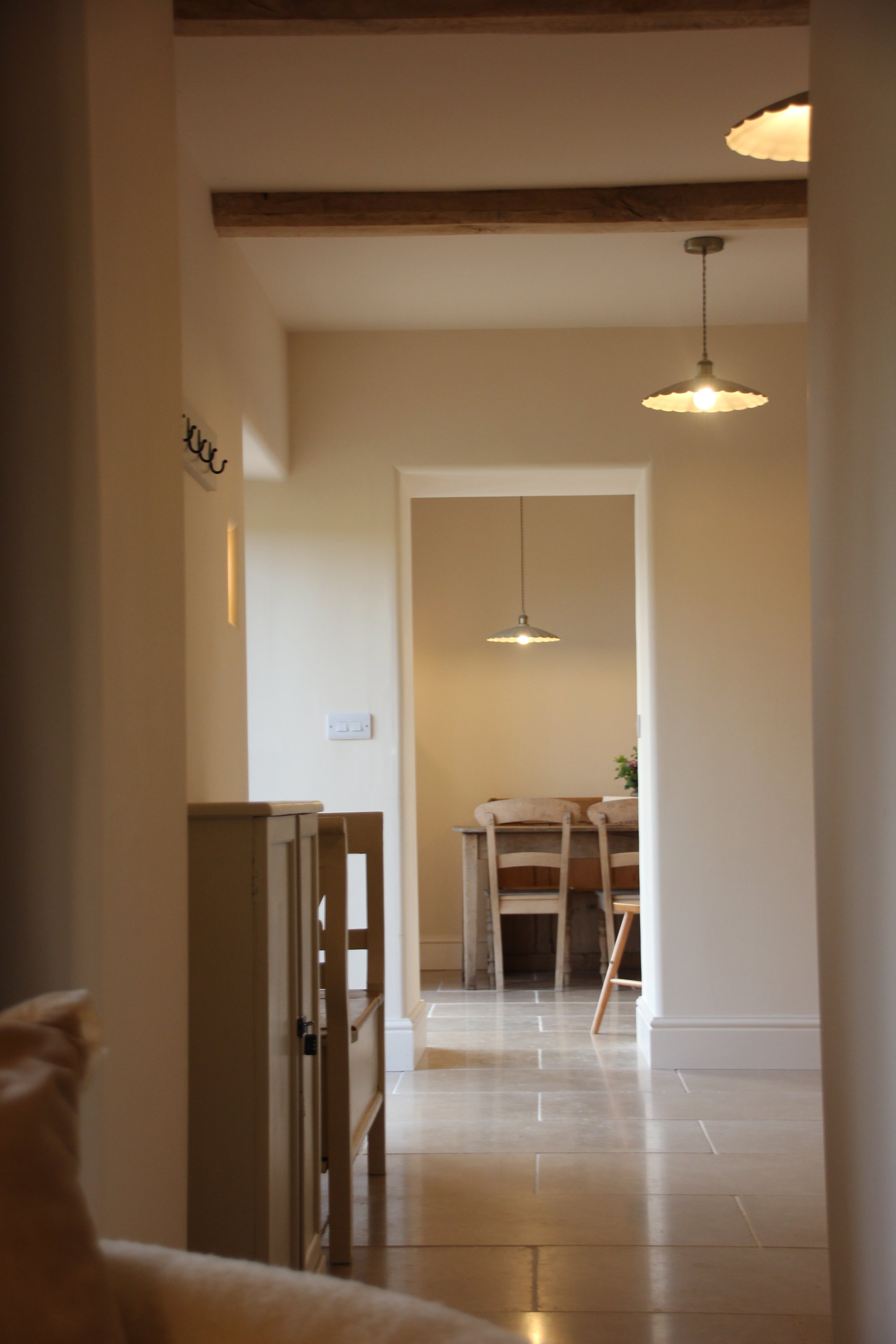 looking through the doorways from the sitting room with the kitchen in view